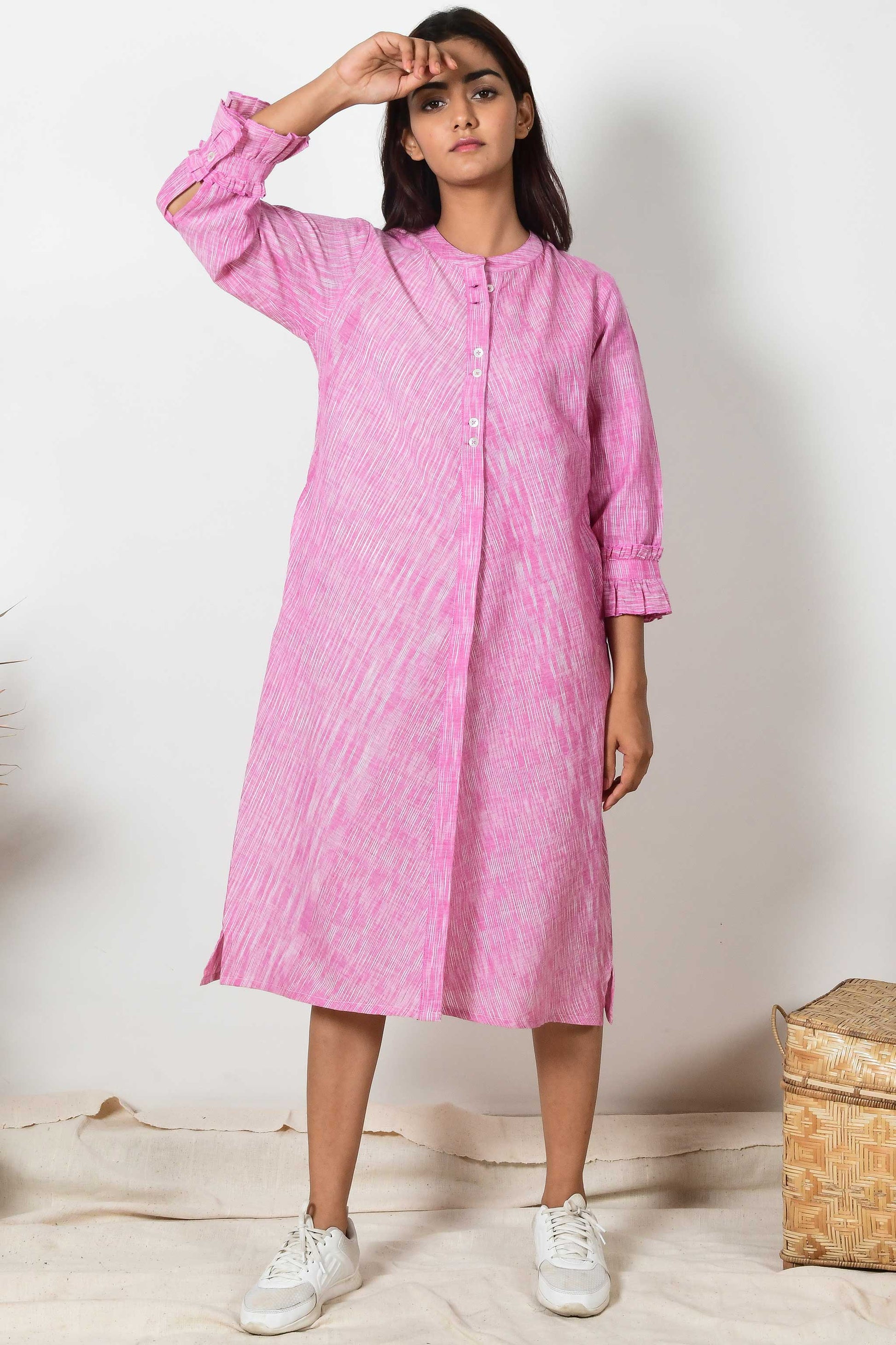 Indian Model wearing an Indian shirt dress of hand spun and handloom cotton in pink colour.