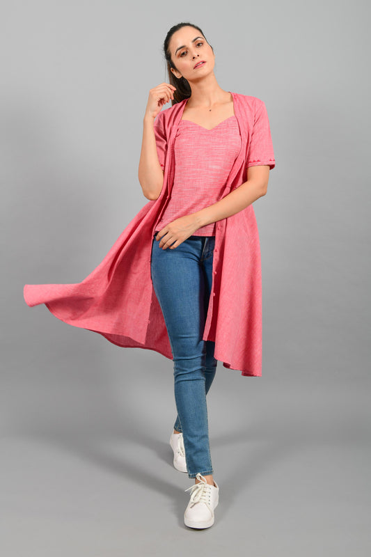 Stylised front pose of an Indian female womenswear fashion model in a red chambray jacket/shrug with space dyed red spaghetti made with handspun and handwoven khadi cotton by Cotton Rack.