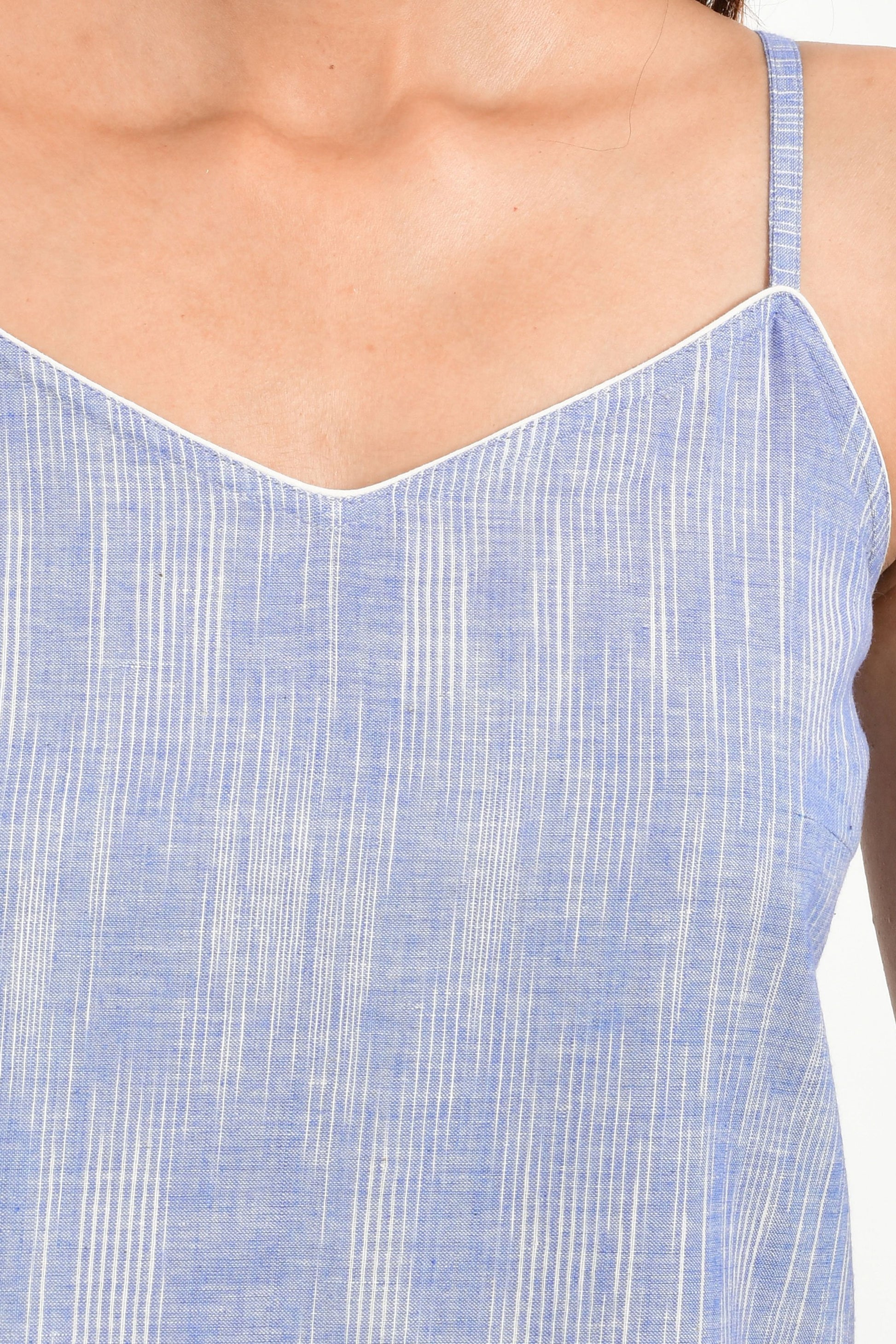 Close Up of an Indian female womenswear fashion model in azo-free space dyed blue handspun and handwoven khadi cotton spaghetti top and boxers by Cotton Rack.