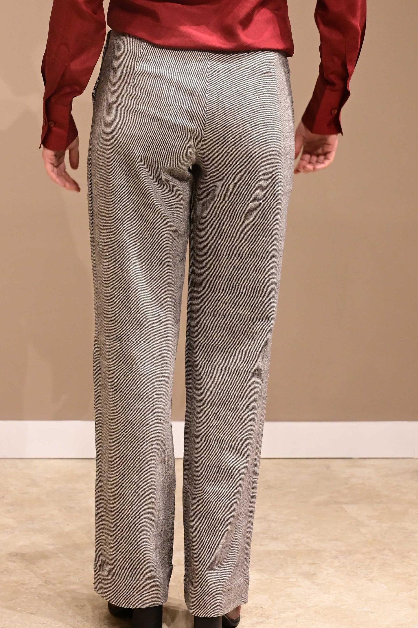 Back of a naturally dyed greyish black denims that is made if handspun and handwoven kala cotton from India.