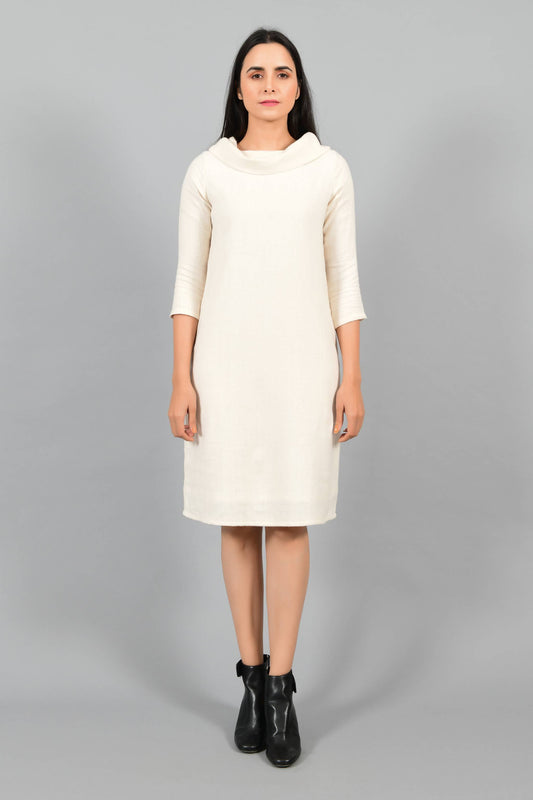 Front pose of an Indian female womenswear fashion model in an off-white Cashmere Cotton Cowl Neck Dress made using handspun and handwoven khadi cotton by Cotton Rack.