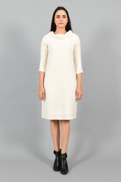 Front pose of an Indian female womenswear fashion model in an off-white Cashmere Cotton Cowl Neck Dress made using handspun and handwoven khadi cotton by Cotton Rack.