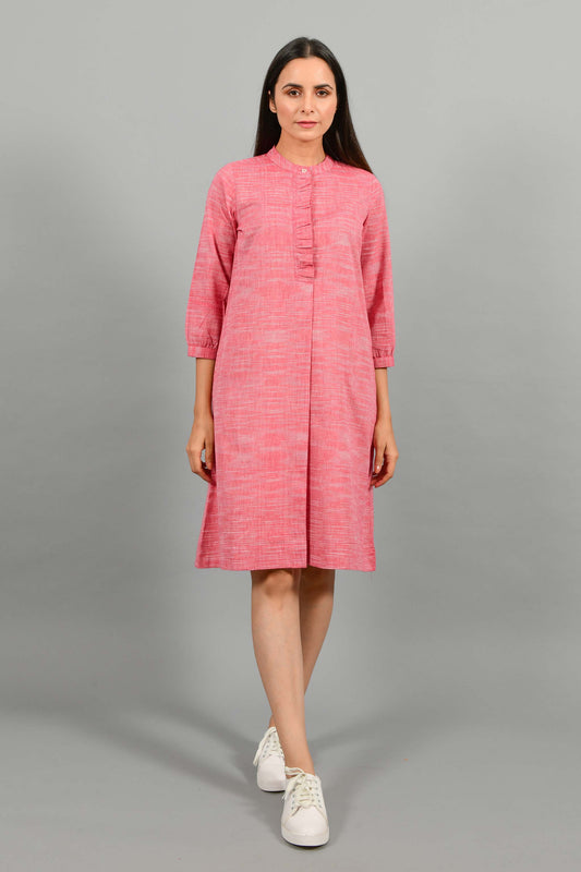 Front pose of an Indian female womenswear fashion model in a red space dyed handspun and handwoven khadi cotton dress with collar and ruffles on front placket by Cotton Rack.
