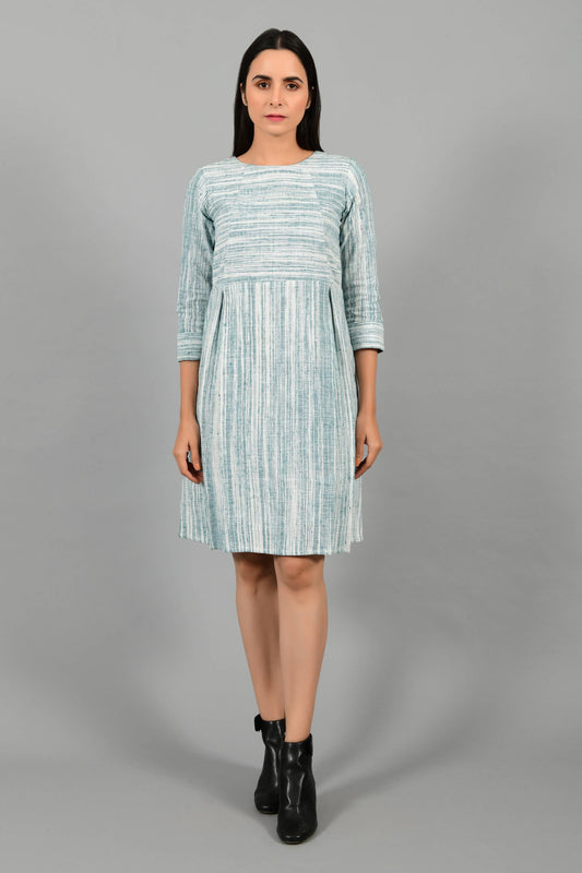 Front pose of an Indian Womenswear female model wearing pine green handspun and handwoven cotton dress by Cotton Rack.