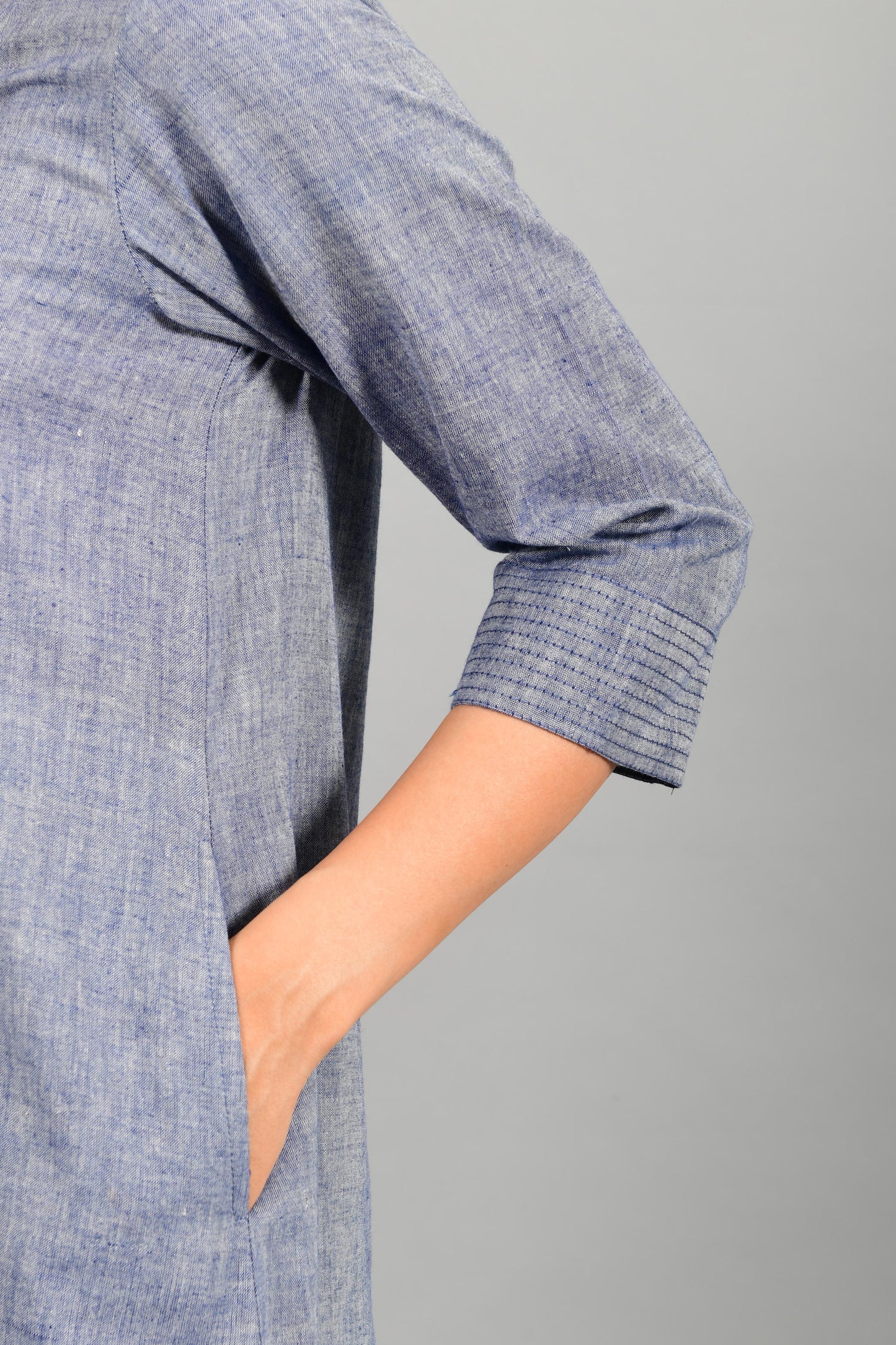 Close up of details of blue chambray handspun and handwoven khadi cotton dress-kurta by Cotton Rack.