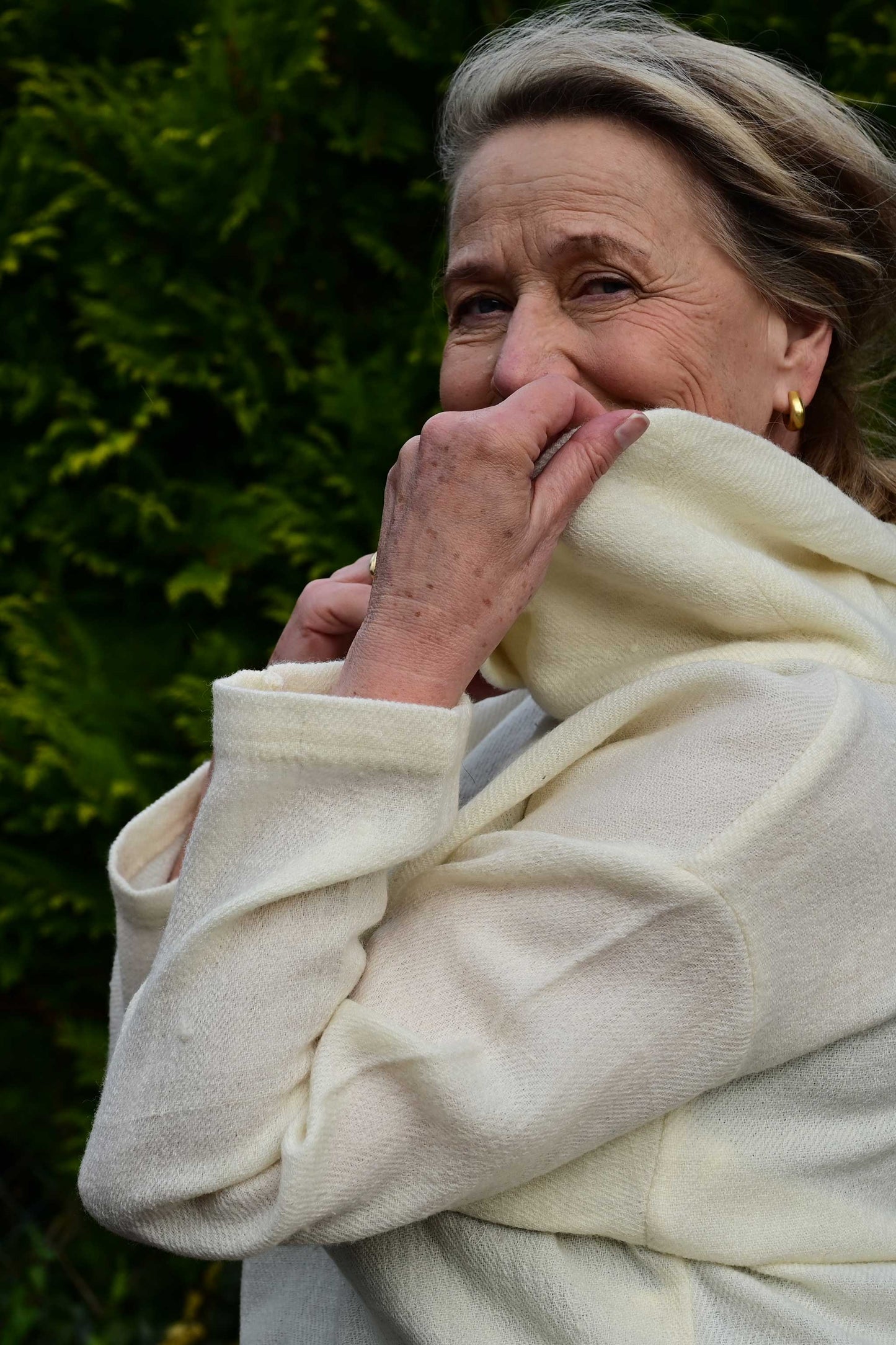 close up of Ivory white cowl neck woolen top made with indigenous Indian wool from Rajasthan. Perfect premium winter clothing for women.