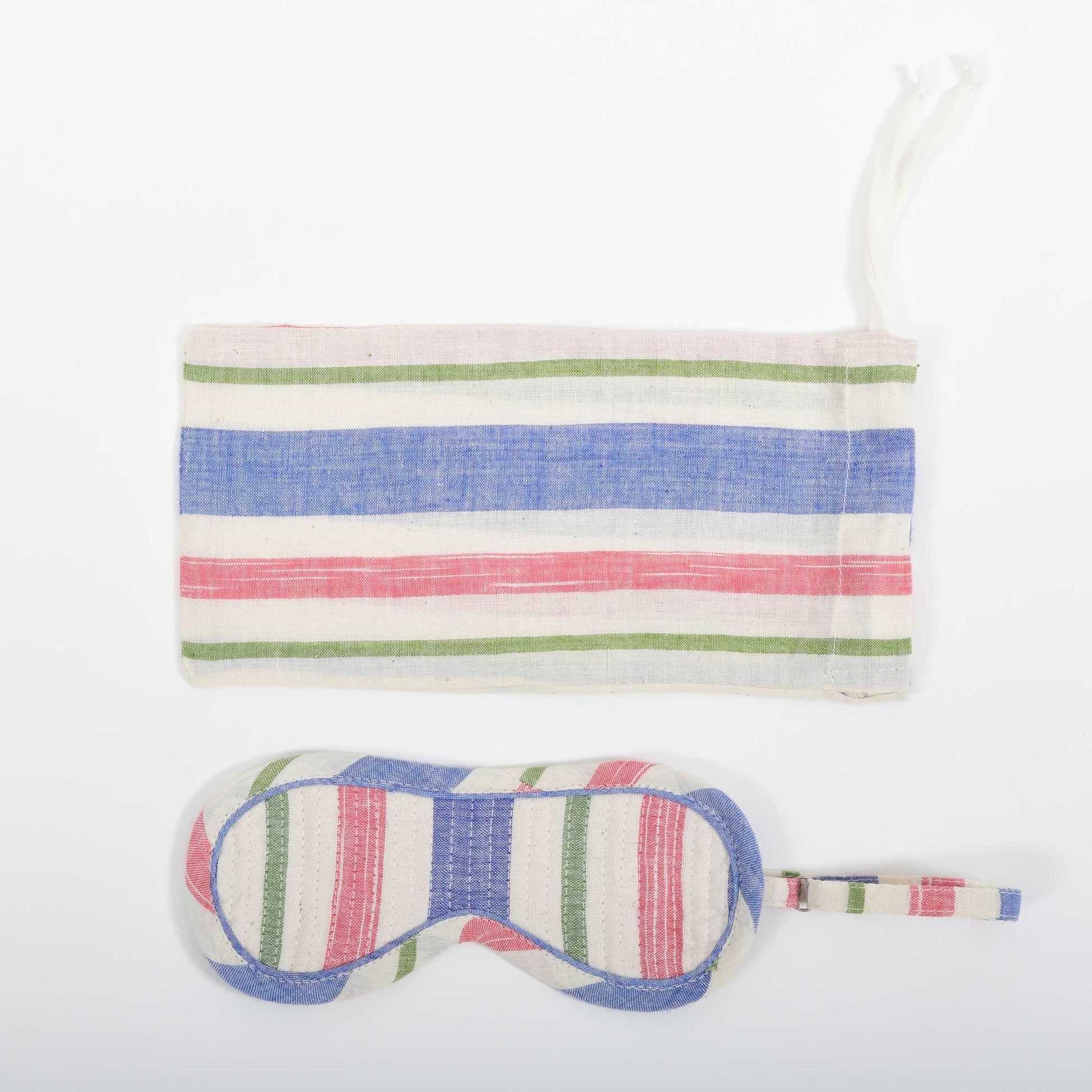 A close-up image from the top of the multi-coloured striped eye mask and it's co-ordinated cover made in handspun and handwoven khadi cotton by Cotton Rack.