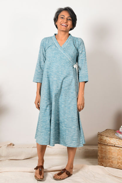 smiling middle aged indian women wearing blue wrap around cotton dress made with pure handspun cotton.