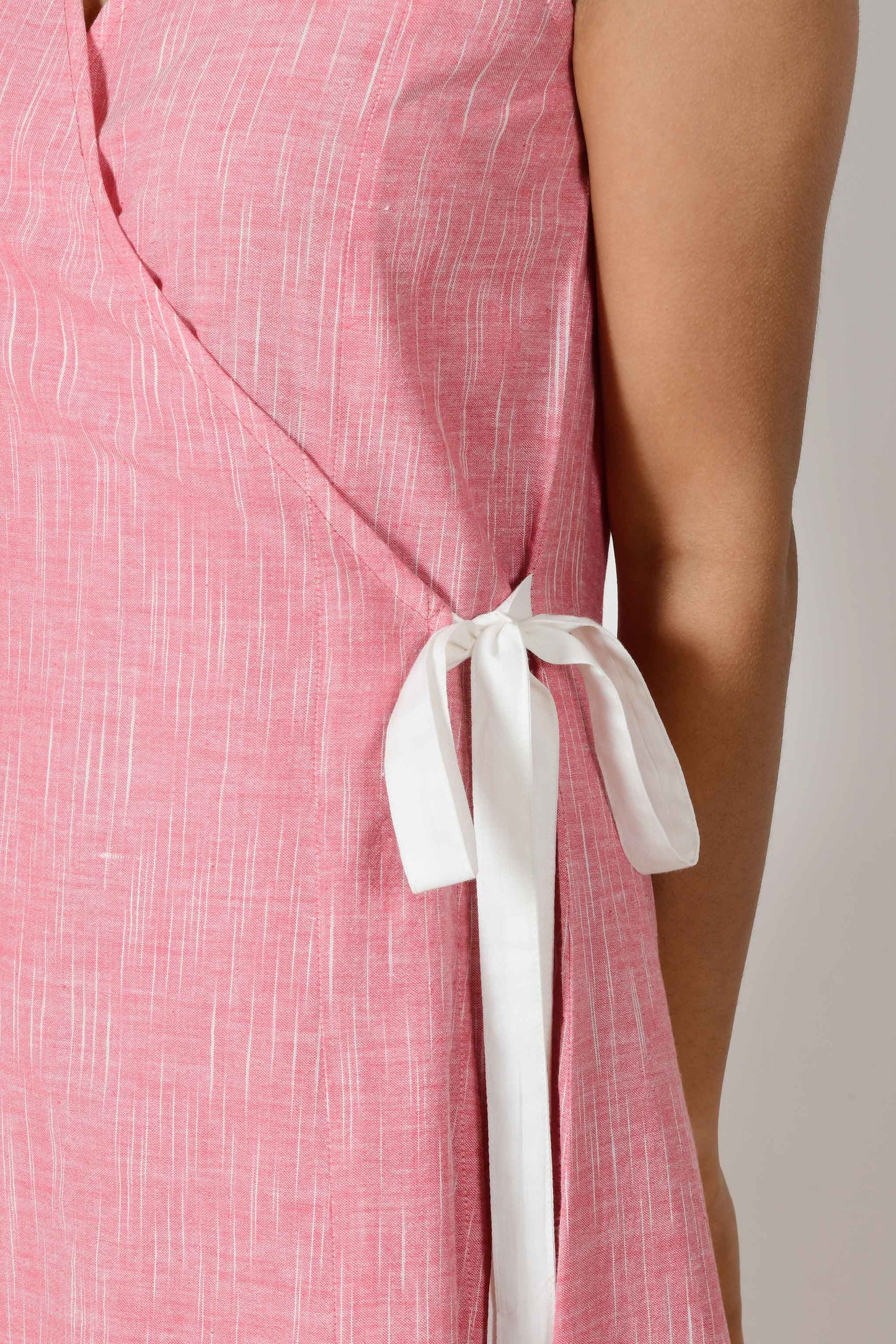 Close up of a detail on a pink dress.