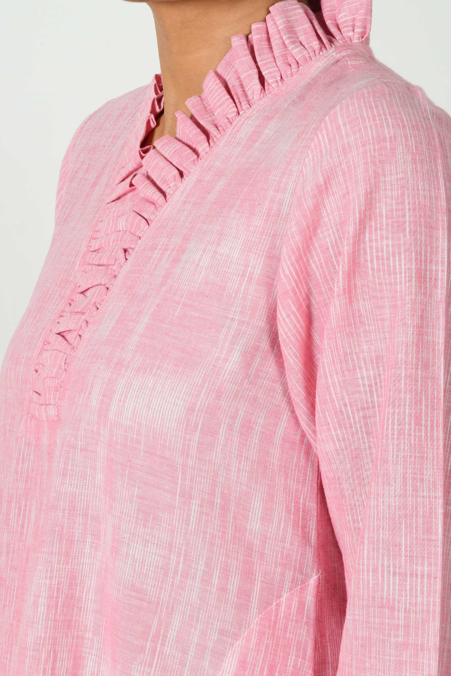 close of the pink flared neck of the textured cotton dress kurta.
