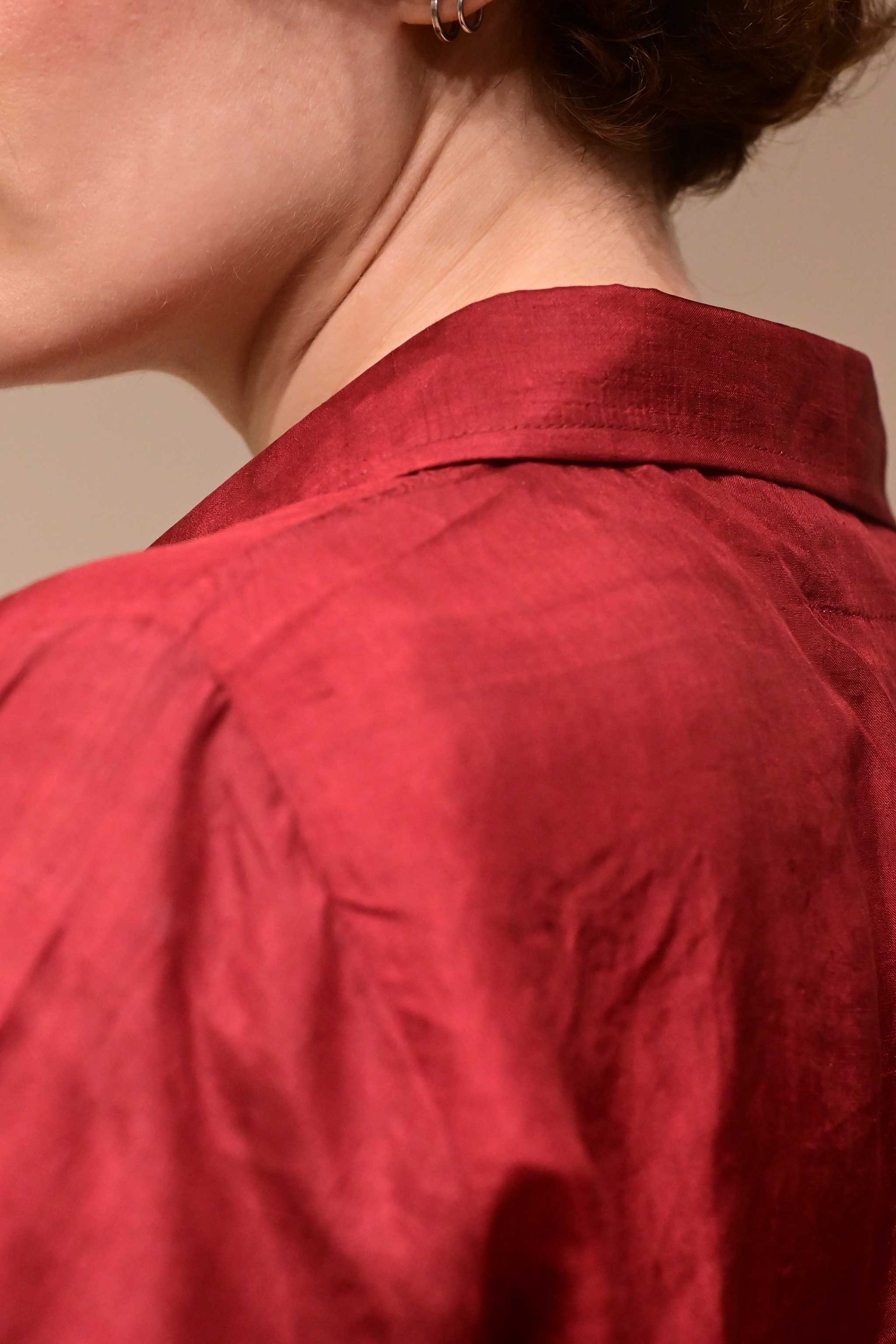 Back Close up of the collar of silk shirt in wine red color that is made from ethically sourced hand reeled and hand spun Indian silk.