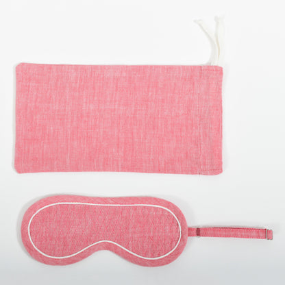 A close-up image from the top of the pink chambray eye mask and it's co-ordinated cover made in handspun and handwoven khadi cotton by Cotton Rack.