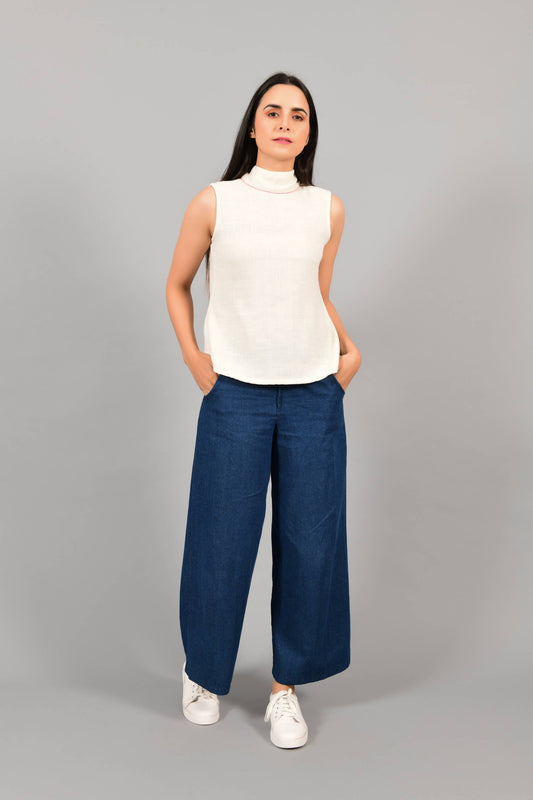 Front pose of an Indian female womenswear fashion model in an off-white Cashmere Cotton Top with a bow collar made with handspun and handwoven khadi cotton by Cotton Rack.