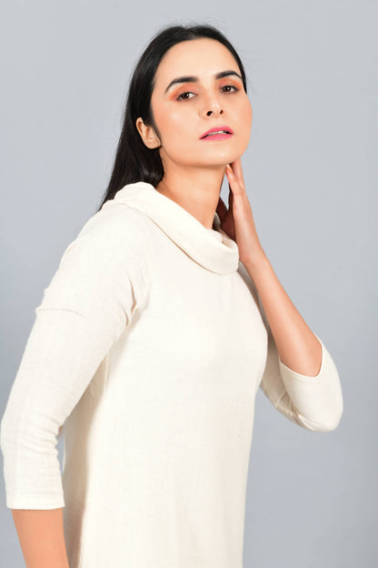 Close Up of an Indian female womenswear fashion model in an off-white Cashmere Cotton Cowl Neck Dress made using handspun and handwoven khadi cotton by Cotton Rack.