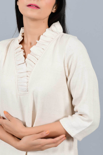 Close Up of an Indian female womenswear fashion model in an off-white Cashmere Cotton Dress with flared neck, made using handspun and handwoven khadi cotton by Cotton Rack.