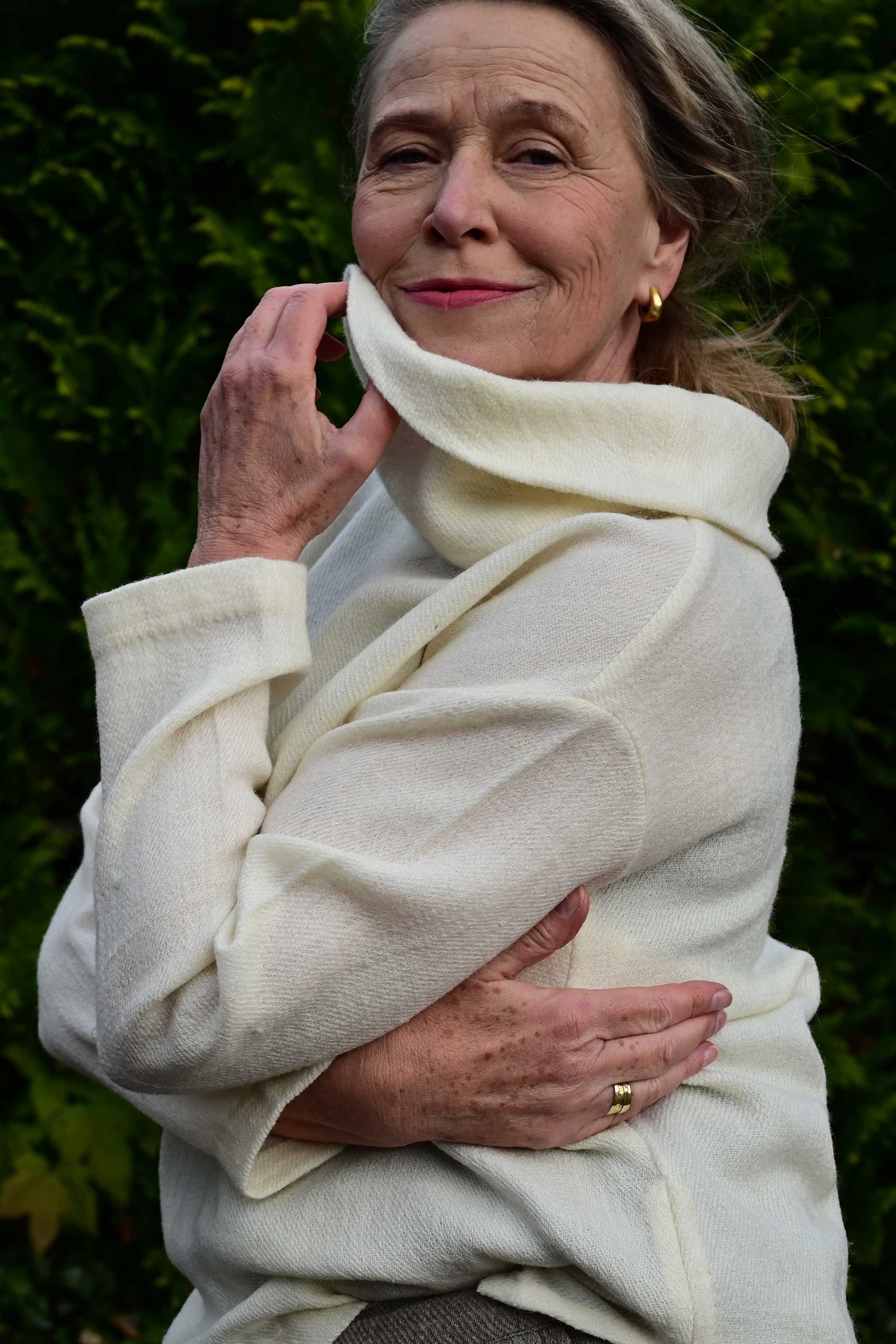 side close up of Ivory white cowl neck woolen top made with indigenous Indian wool from Rajasthan. Perfect premium winter clothing for women.